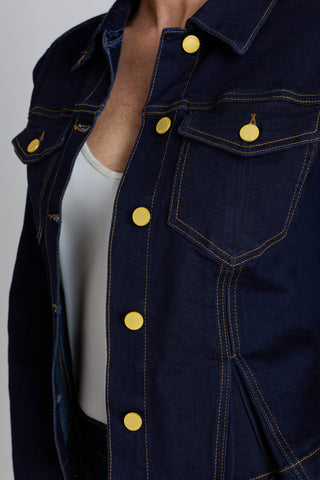 Detail of the Bethanie Denim Jacket in indigo showing the gold front buttons