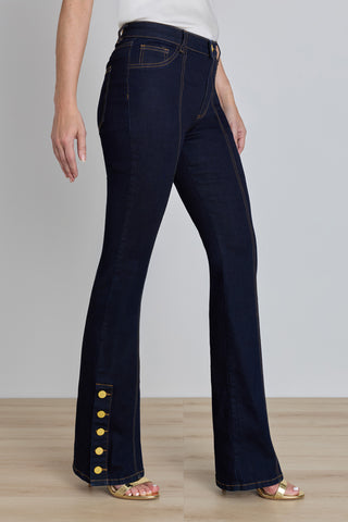 Detail of the Veronica Button Jean in indigo showing the gold outer-ankle buttons