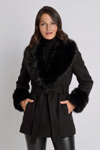 Isabel Fur Trim Coat in Black worn by model, belted black wool-blend coat with black faux fur collar and cuffs, front view, The Noli Shop