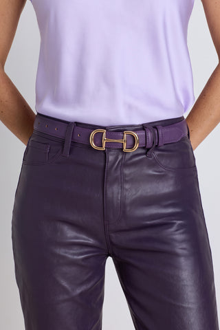 The Bettie Belt in midnight plum worn at the waist, showing the gold horsebit buckle