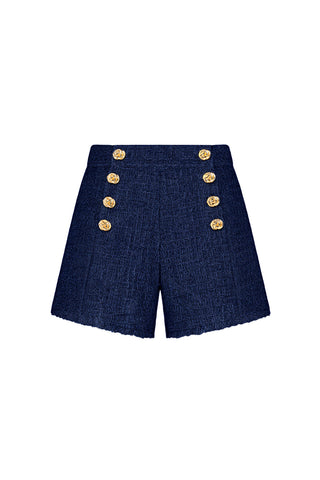 The Tamara Tweed Button Short - Navy features six gold decorative buttons in two front rows, a gold side zipper, tailored fit, and raw-edged hems for an elegant look.