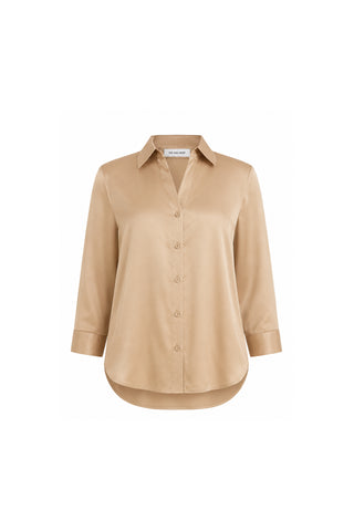The Sara Silk Blouse - Mocha features long sleeves, a collar, and a curved hem in smooth, slightly shiny beige silk. Shown on a white background, it’s a polished wardrobe staple.